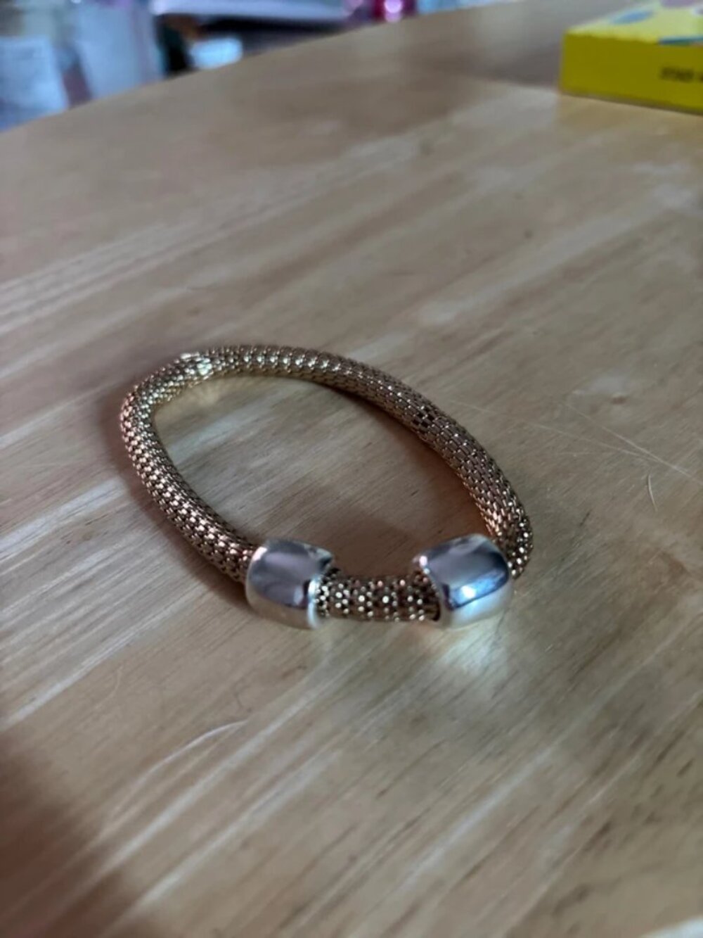 Gold tone stretch bracelet w/silver tone stations